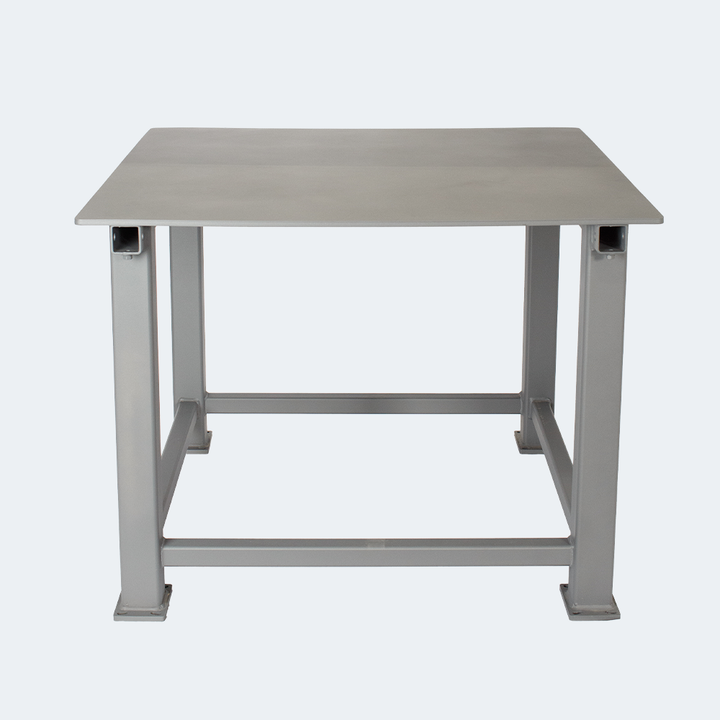 Powder-coated steel table frame with anchor bolt feet for shop floor mounting